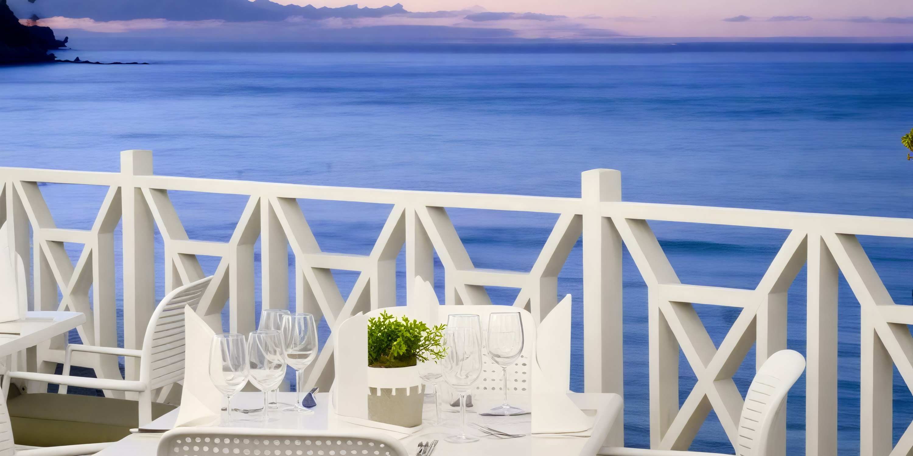 Elegant outdoor dining setup at Bahia Principe Grand El Portillo, perfect for a destination wedding by the calm blue sea.