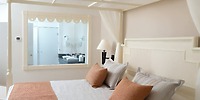 Bahia Principe Grand Samana bedroom: serene neutrals, perfect for destination wedding stays, modern bath view.