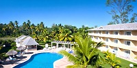 Bahia Principe Grand Samana: outdoor pool area with lounge chairs, palm trees, ideal for weddings.
