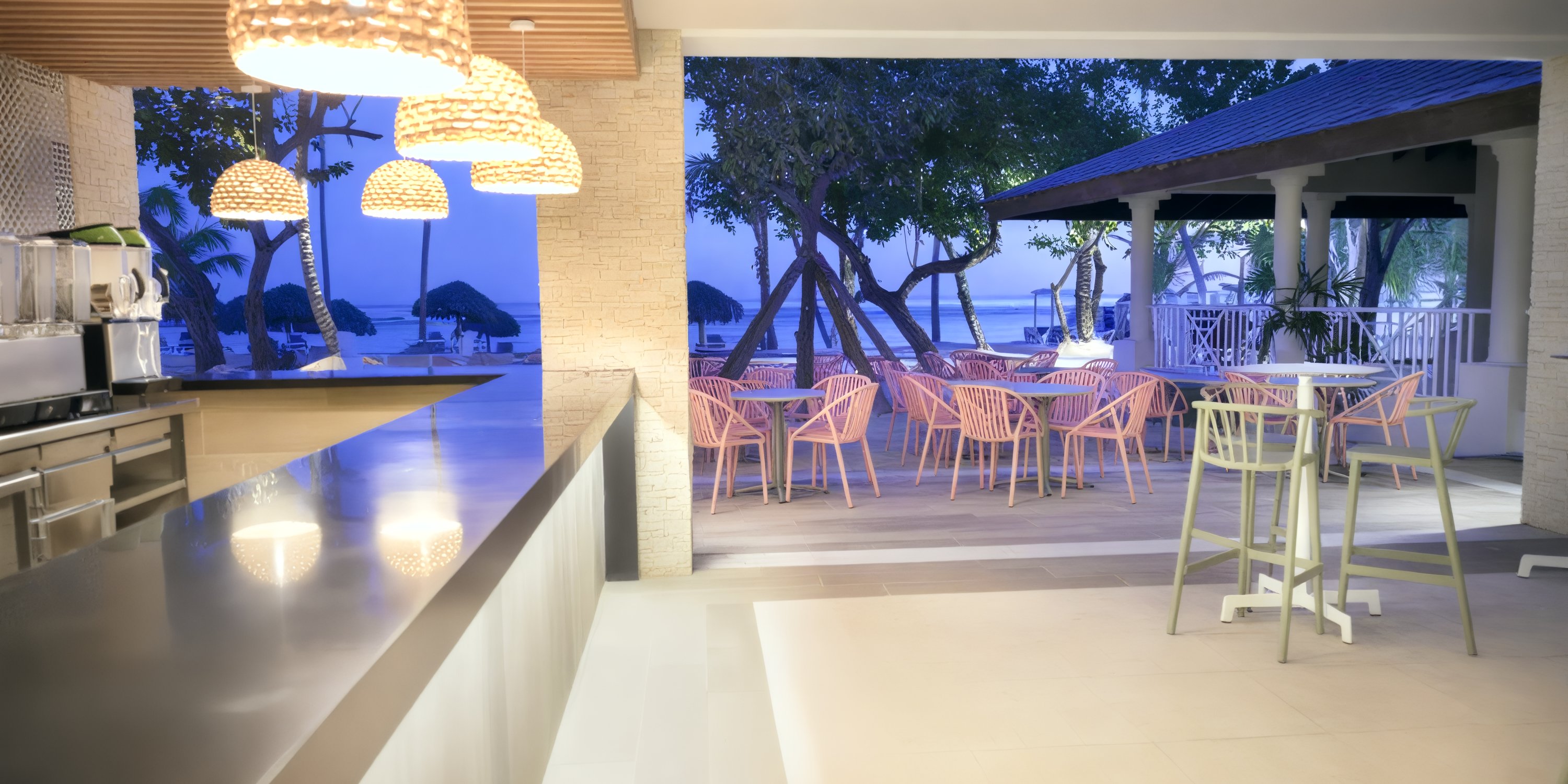 Indoor-outdoor bar with wicker chairs at Bahia Principe Grand Samana, perfect for a destination wedding.