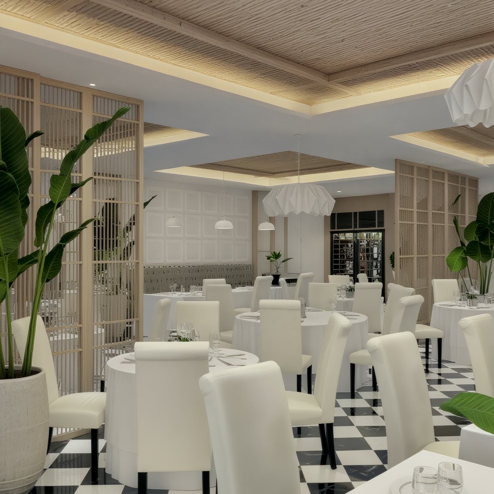 Chic destination wedding venue with white chairs, round tables, checkered floor, and lush large plants.
