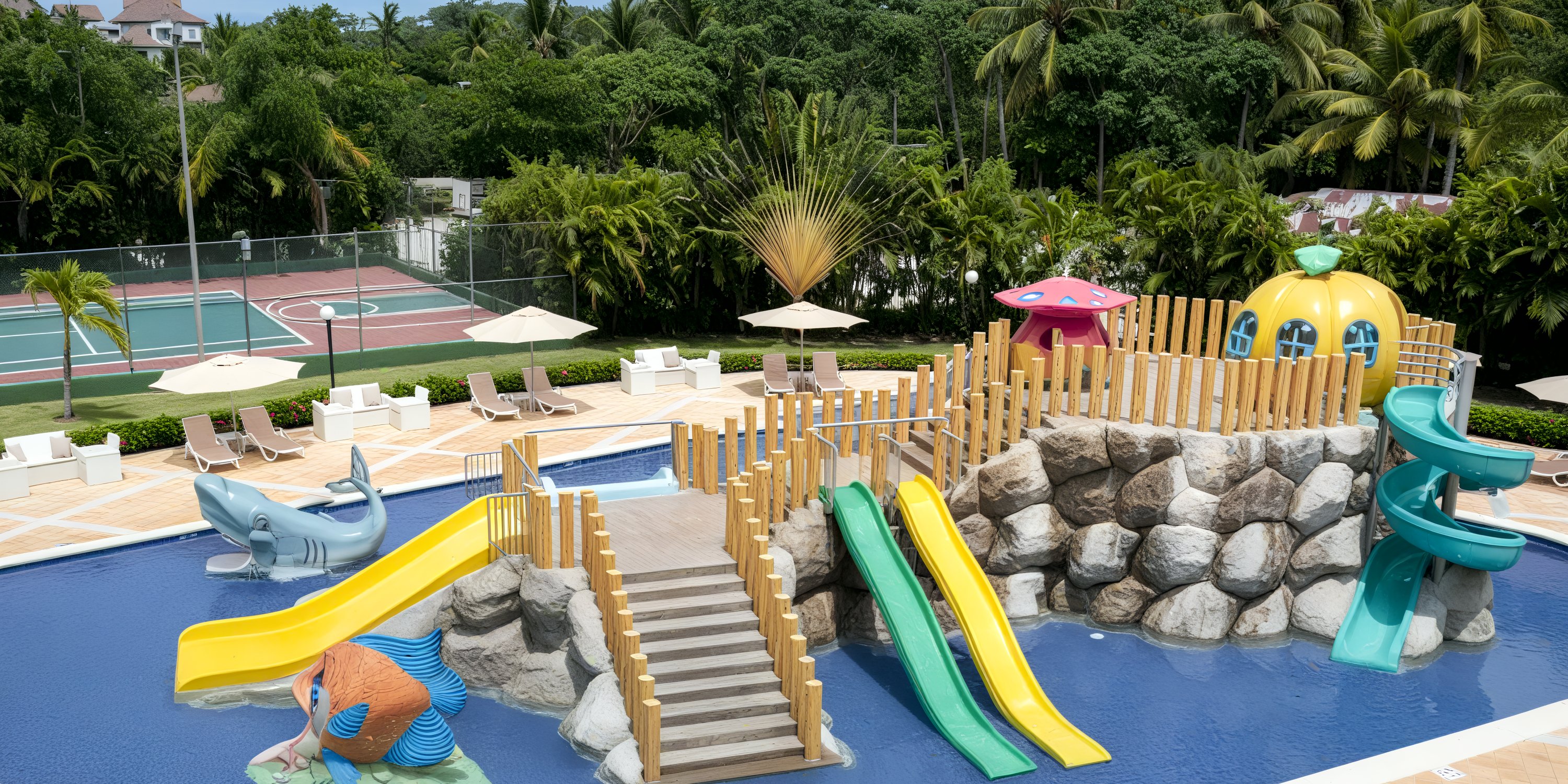 Bahia Principe Grand Samana: Destination wedding spot featuring kids' pool, slides, and tennis courts in lush greenery.