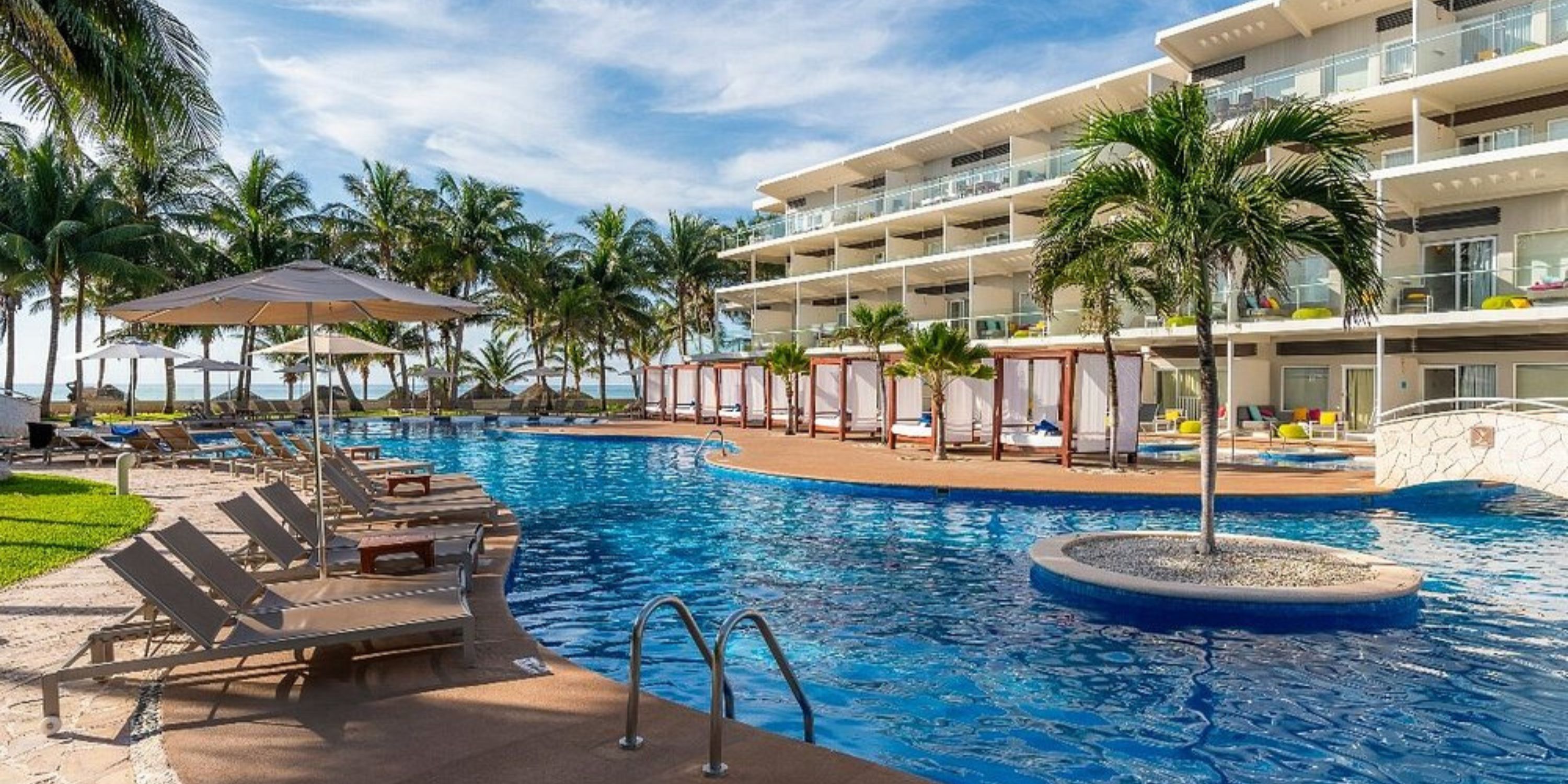 Iberostar Selection Riviera Cancun: modern resort, perfect for destination weddings with pools, palms & hotel.