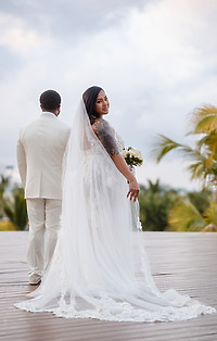 A woman wearing the "Leah and Ben (Copy)" gown, perfect for a romantic destination wedding.
