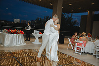 Kaitlyn and Chad (Copy) dance on a glowing floor at an outdoor destination wedding in the evening.