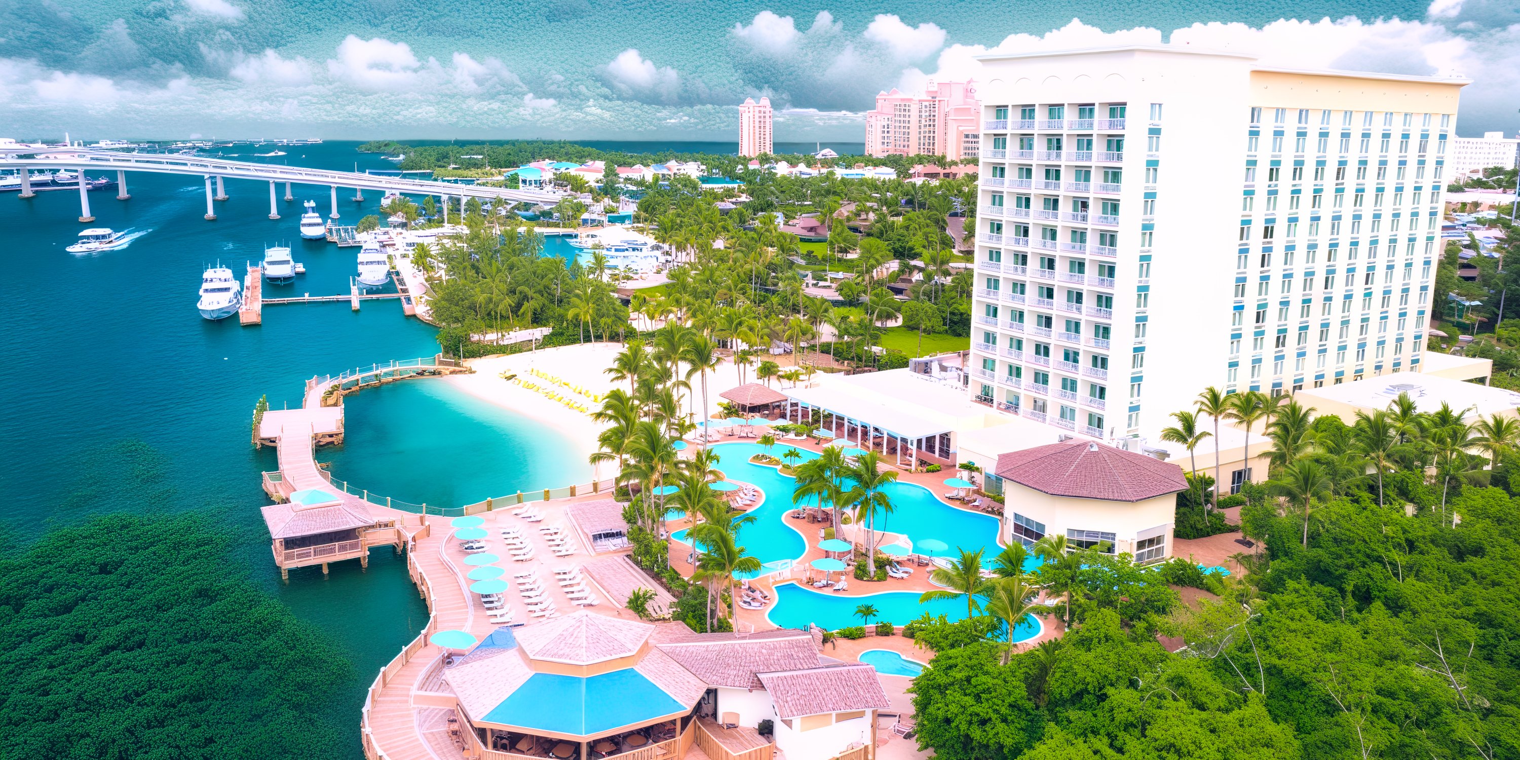 Aerial view of Warwick Paradise Island Bahamas—a stunning destination wedding spot with pools, beach, marina.
