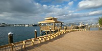 Warwick Paradise Island Bahamas pier with gazebo, perfect for a destination wedding, overlooks marina boats.