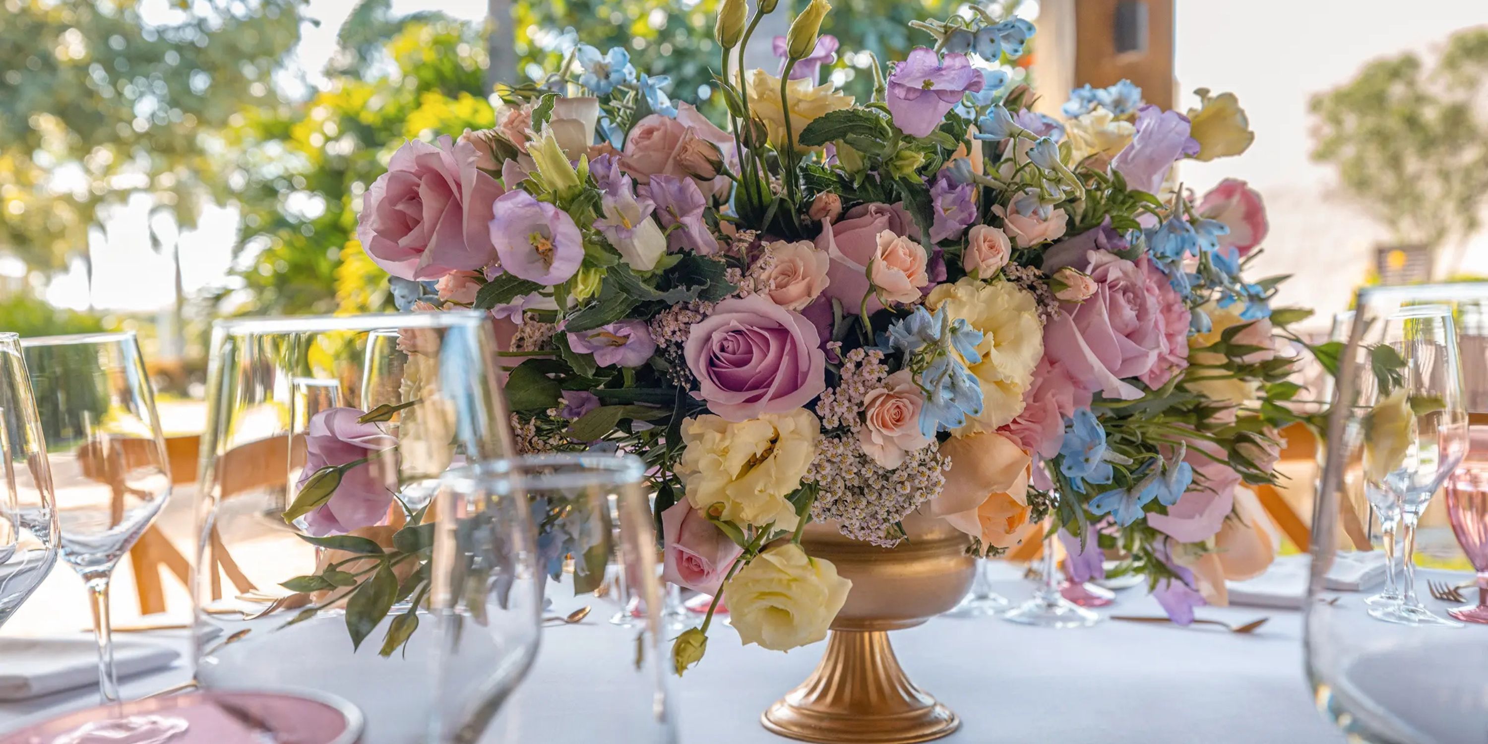 Pastel flower centerpiece arranged for a destination wedding at Moon Palace The Grand Punta Cana.
