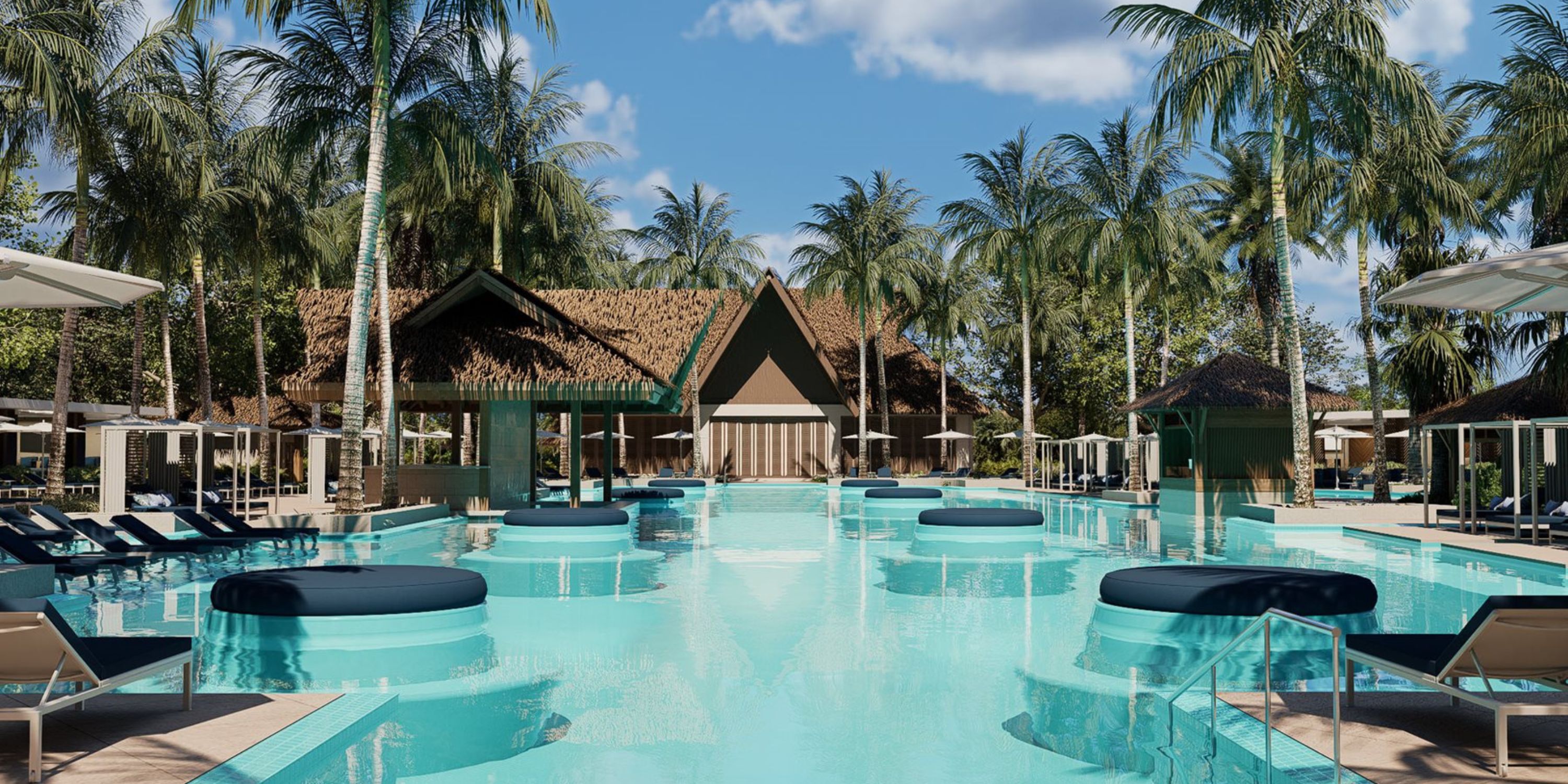 Large pool at Moon Palace The Grand, perfect for a destination wedding, with loungers and cabanas.
