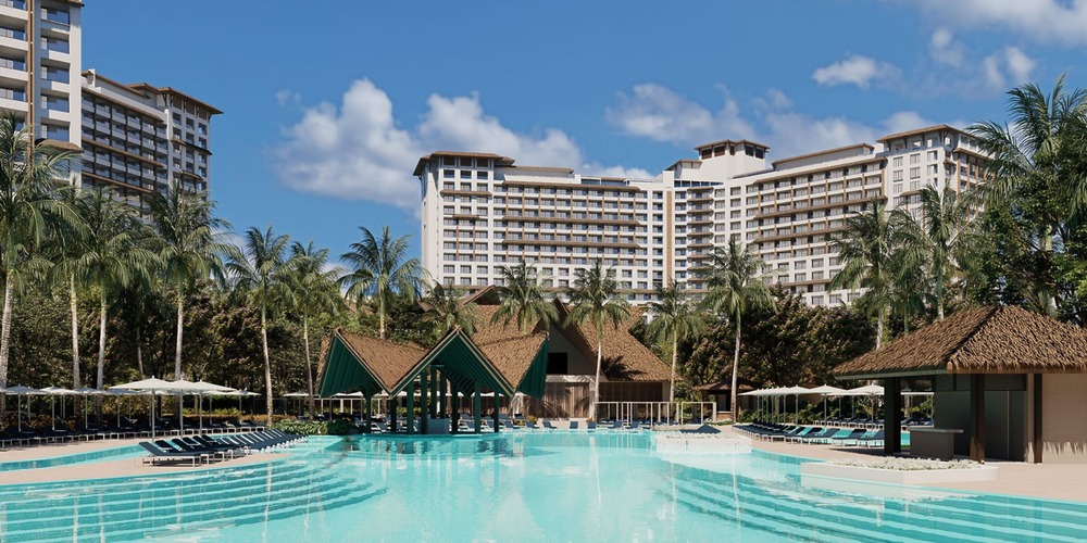 Moon Palace The Grand’s pool, palm trees, and cabanas create a dreamy destination wedding setting.