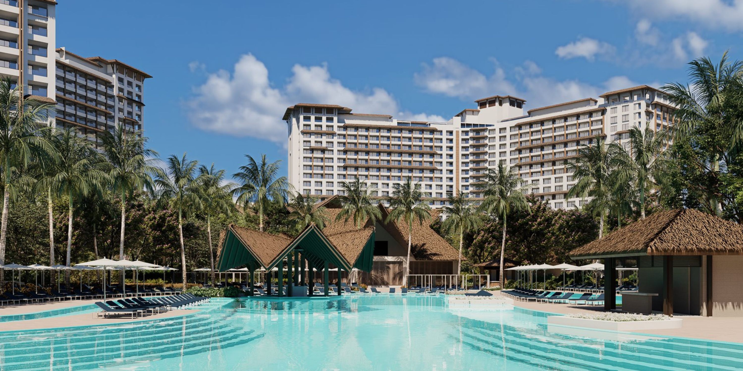 Moon Palace The Grand&rsquo;s pool, palm trees, and cabanas create a dreamy destination wedding setting.