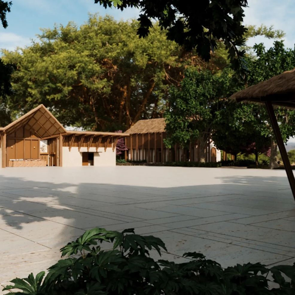 Thatched-roof buildings amidst lush greenery on a sunny day, perfect for a destination wedding.
