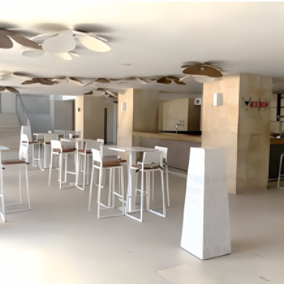 Chic, minimalist bar area with high tables and stools, perfect for a stylish destination wedding.