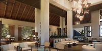 Hyatt Vivid Grand Island lobby, ideal for destination weddings, with wooden ceiling and modern seating.