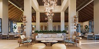 Hyatt Vivid Grand Island: Elegant lobby with chic seating and geometric lights, ideal for destination weddings.
