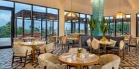 Ocean Allure Costa Mujeres is perfect for a destination wedding with round tables, cushioned chairs, and large windows.