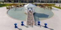 Ocean Allure Costa Mujeres is a popular destination wedding spot with a white gazebo over a circular pool.