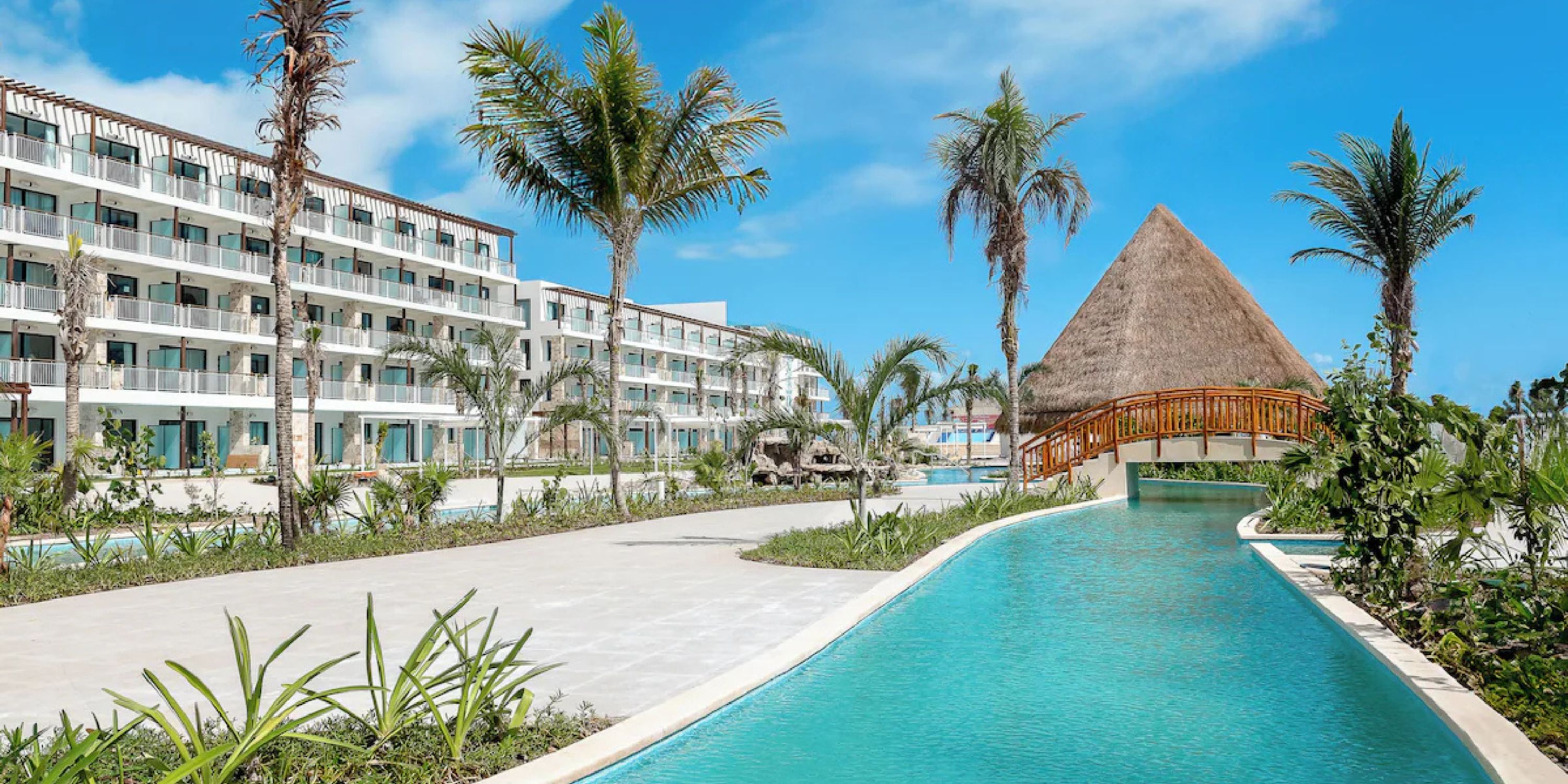 Ocean Coral and Turquesa is a stunning destination wedding venue with modern buildings, pool, and cabana.