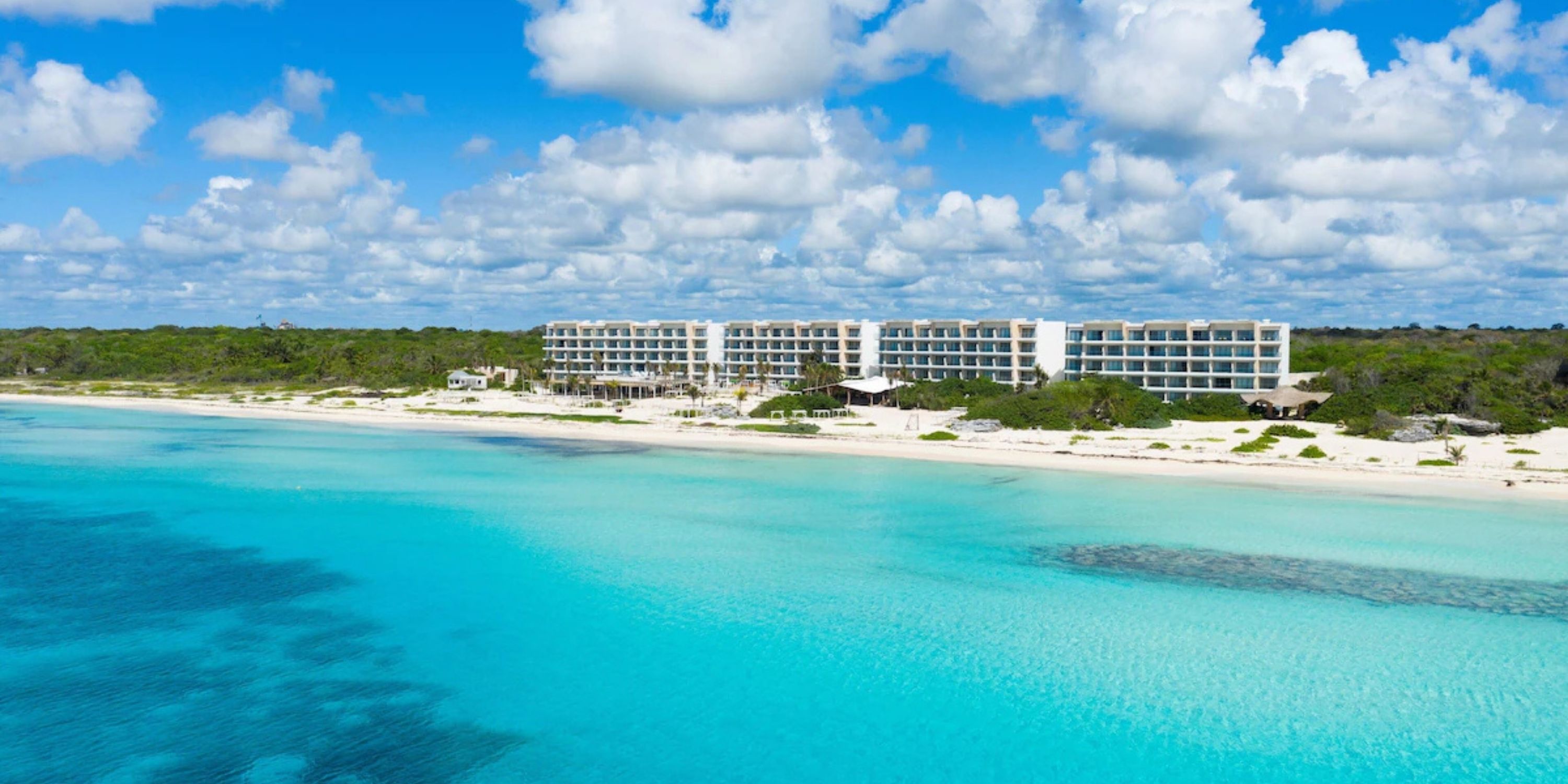 Sandos Playacar is a modern beachfront resort, perfect for a destination wedding on white sand beaches.