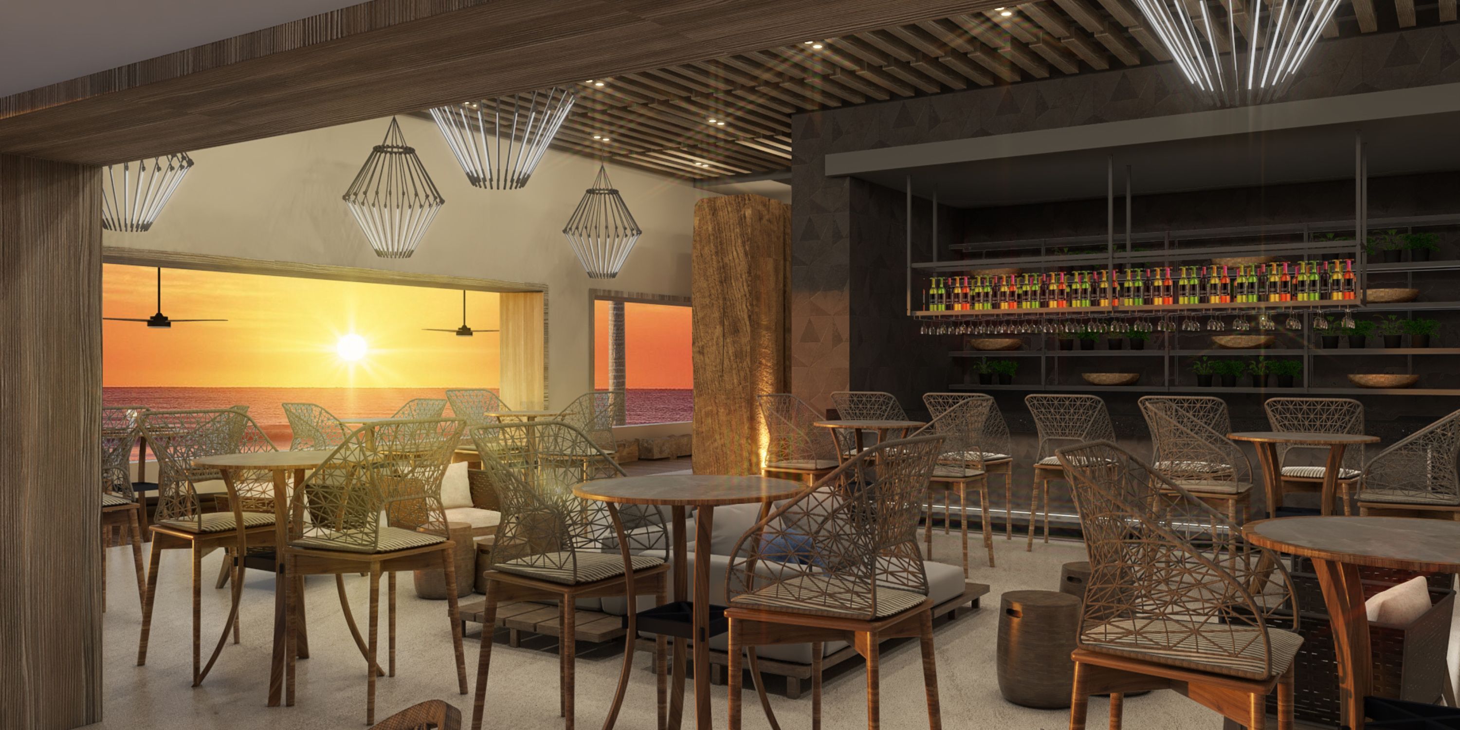 Royalton Chic Antigua: chic restaurant with wicker chairs, ocean view&mdash;perfect for a destination wedding.