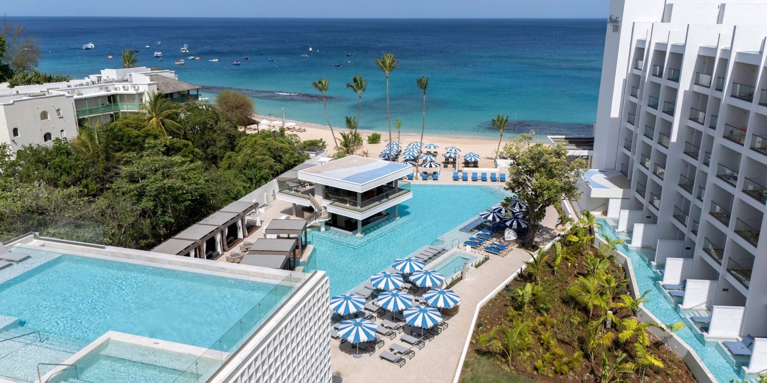Royalton Vessence Barbados pool, perfect for a destination wedding, overlooks beach and blue ocean.