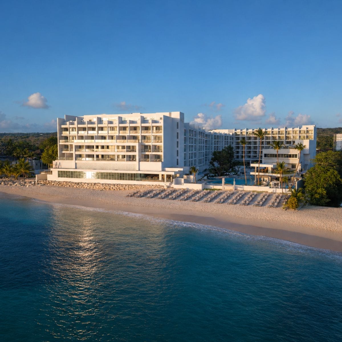 Royalton Vessence Barbados: Modern beachfront hotel with balconies, ideal for destination weddings.