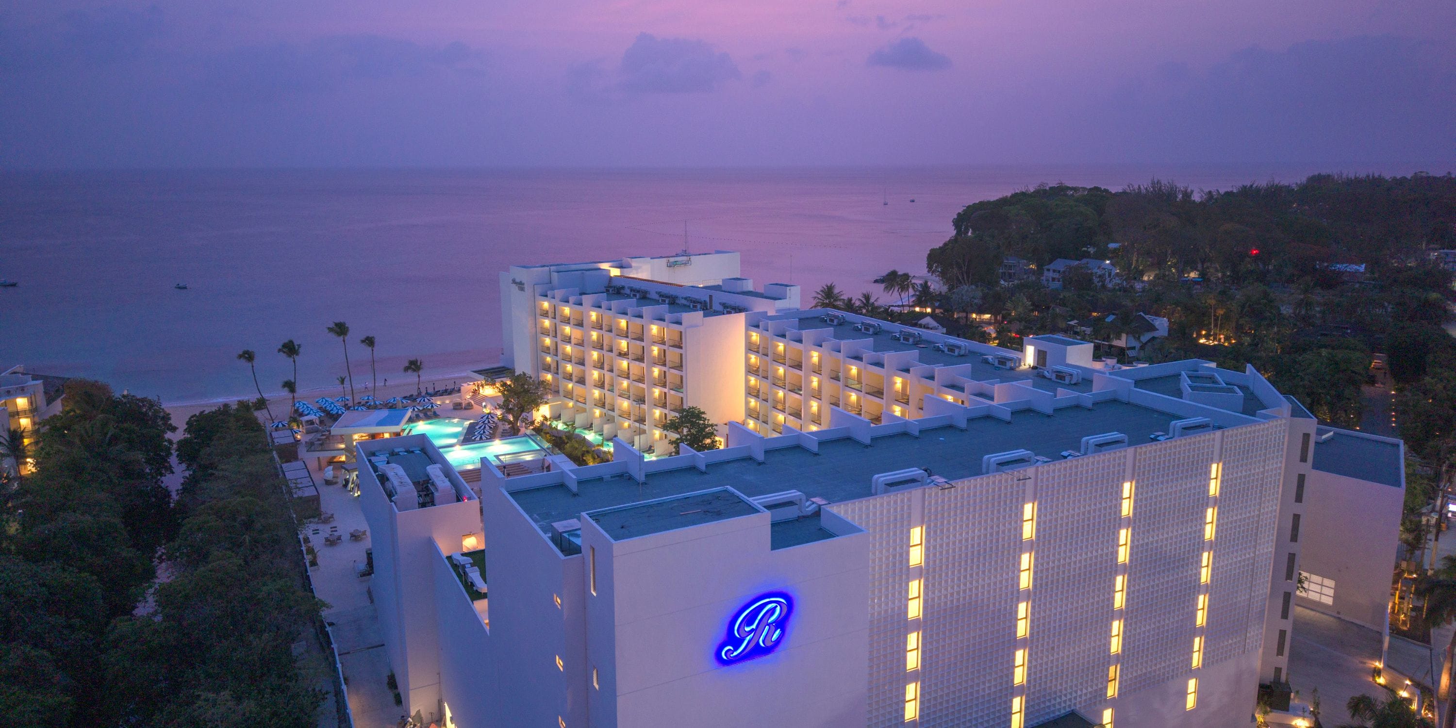 Royalton Vessence Barbados at dusk, perfect for a destination wedding by the pool and ocean.