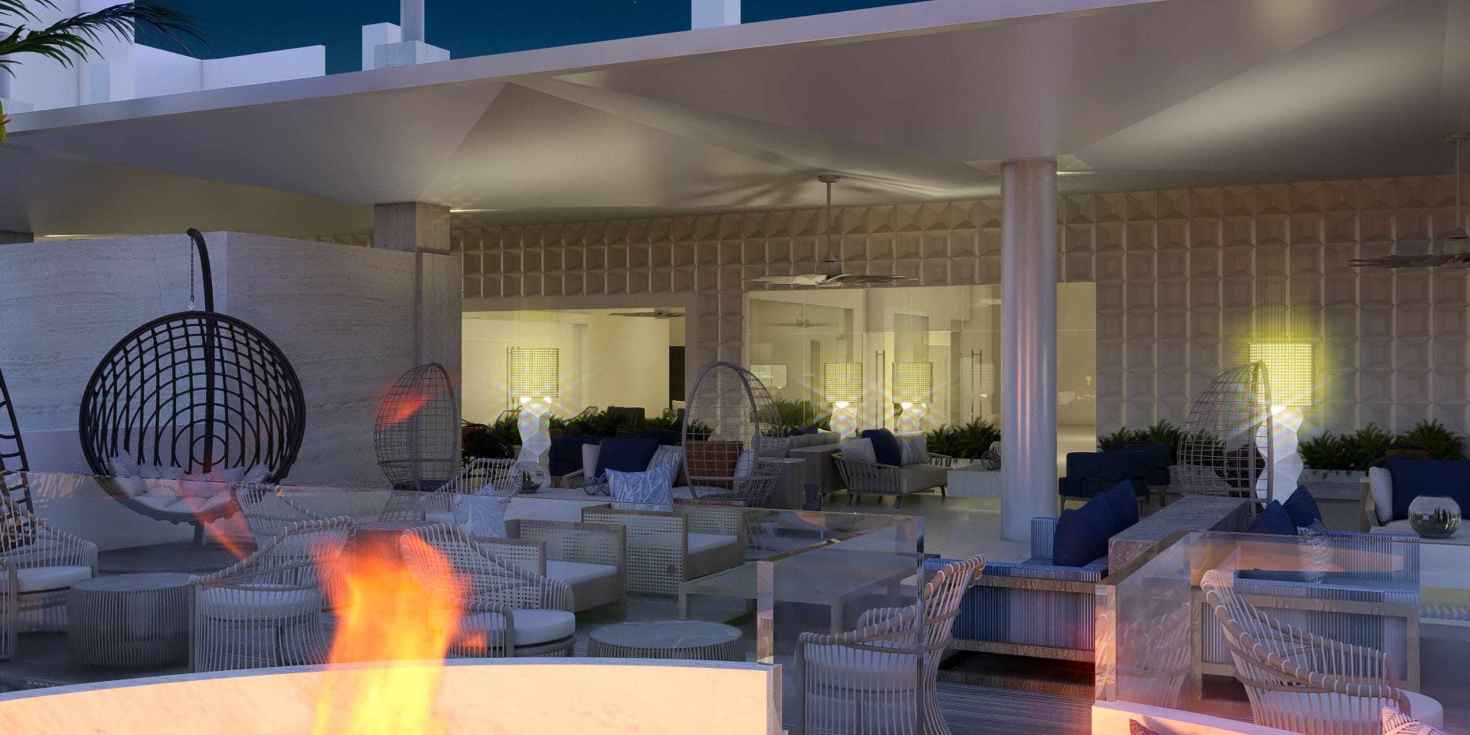 Nighttime lounge at Royalton Vessence Barbados, ideal for destination weddings, with modern seats and fire pit.