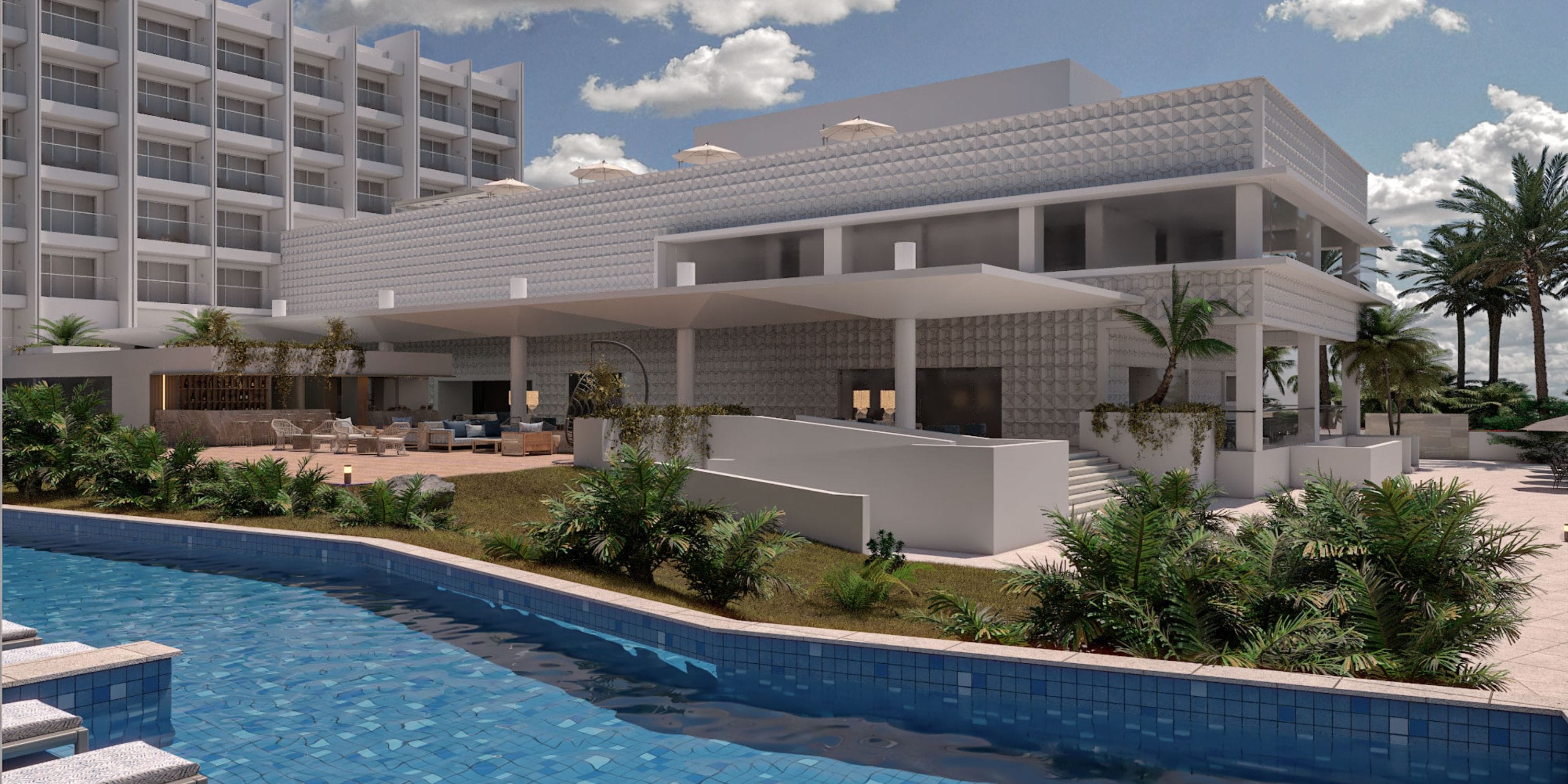 Royalton Vessence Barbados hotel, perfect for a destination wedding, features a pool and palm trees.