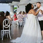 Bride and groom share their first dance at a destination wedding reception.