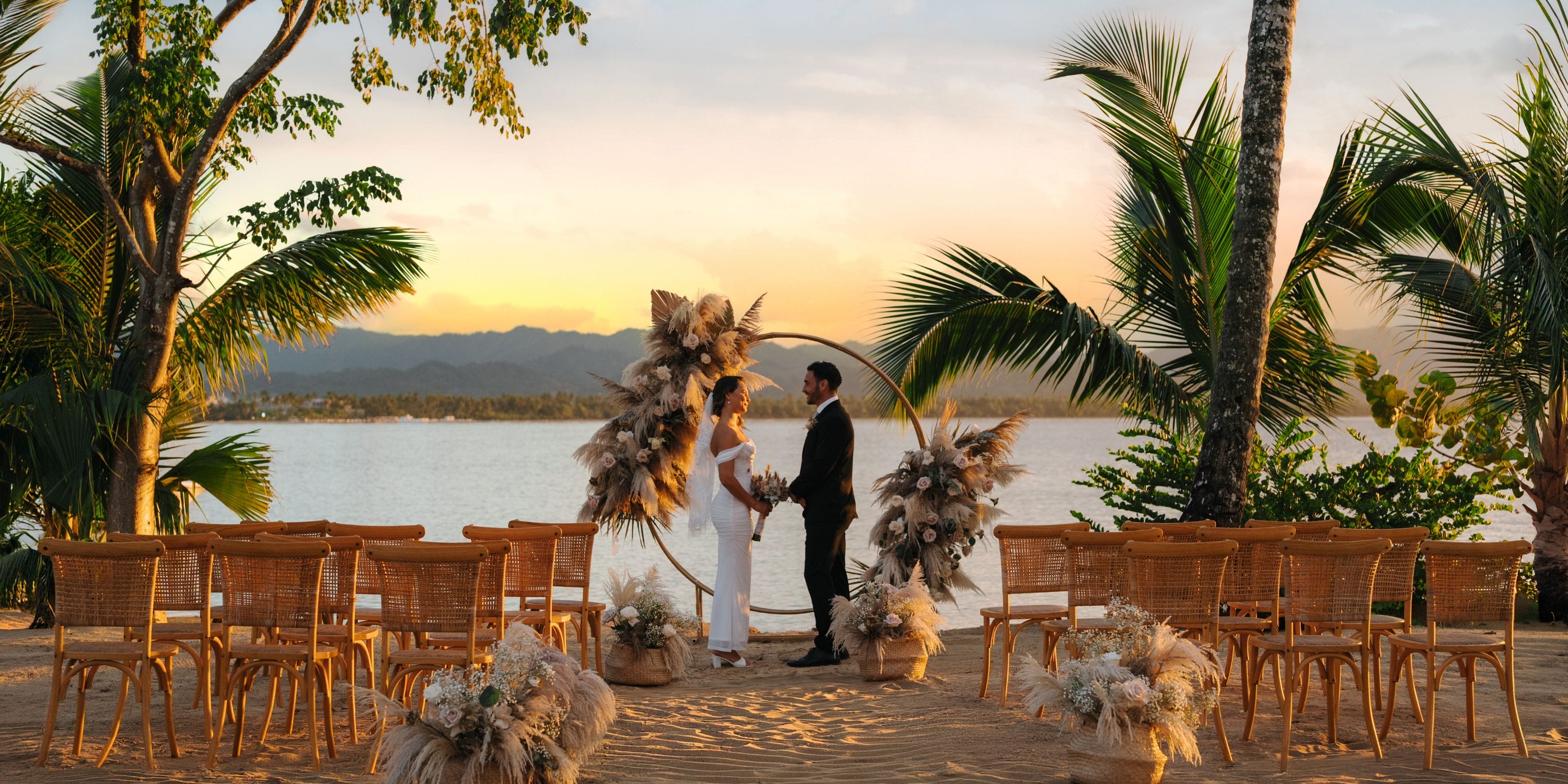 A destination wedding at sunset on the beach at Zemi Miches Punta Cana All-Inclusive Resort.