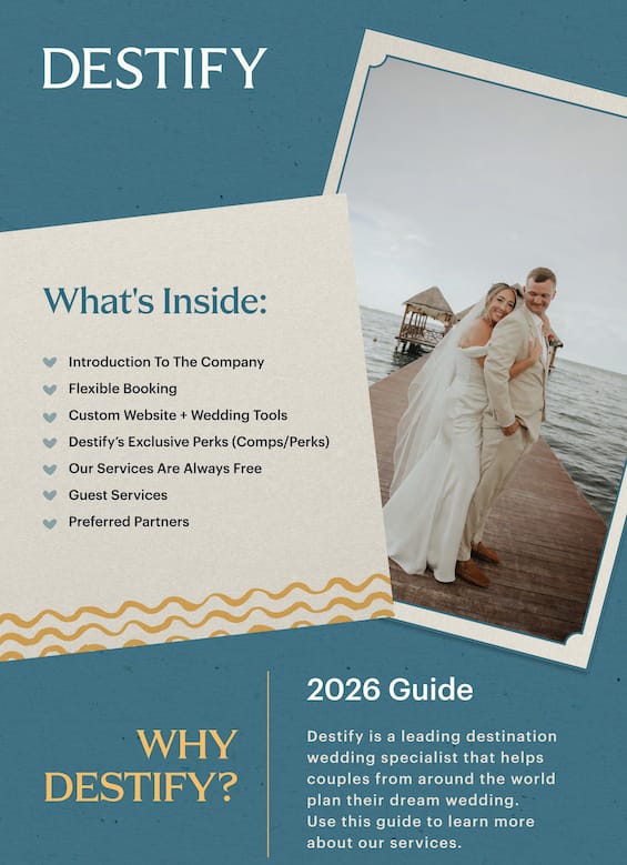A wedding couple smiles on a wooden pier by the water, ideal for a romantic destination wedding.