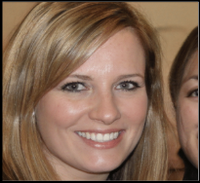 Woman with straight blonde hair smiling at a destination wedding, guest partly visible on the right.