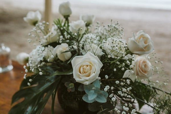 White rose, baby’s breath, and greenery bouquet for a JW Marriott Costa Elena destination wedding.