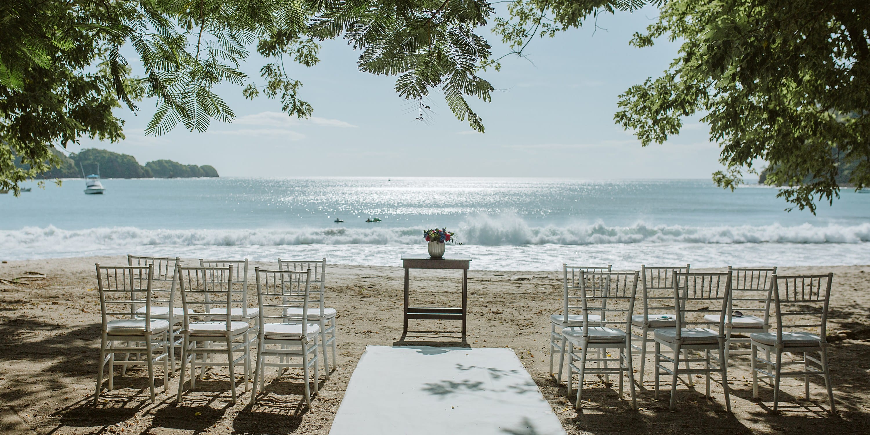 White chairs arranged for a destination wedding at JW Marriott Costa Elena Resort and Spa.