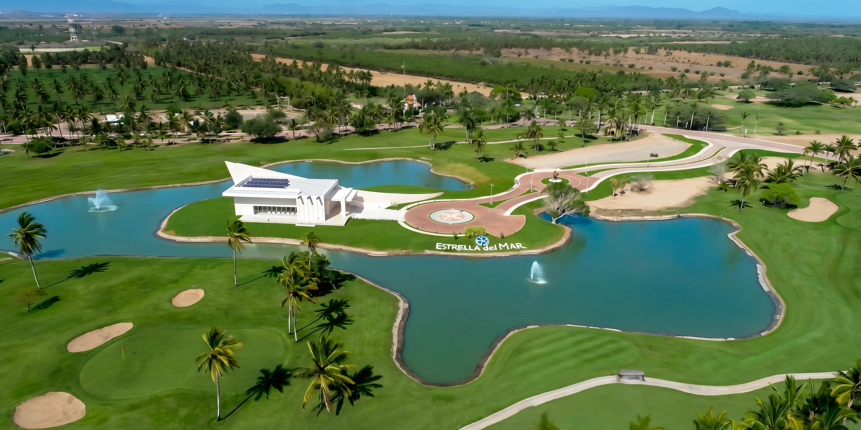 Aerial view of Estrella del Mar clubhouse, a top wedding spot surrounded by water and greenery.