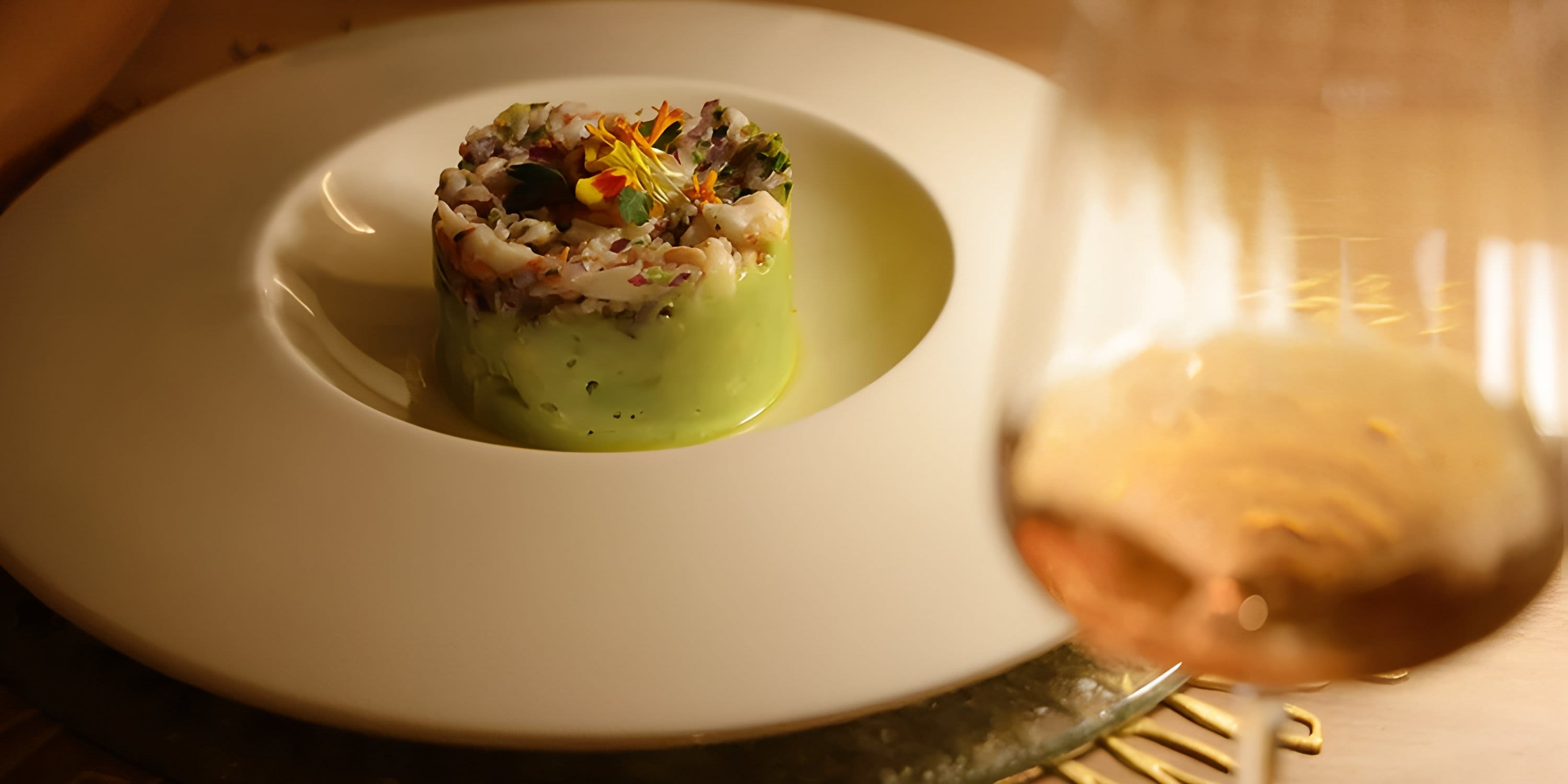 Appetizer with greens and a light drink at a Hotel Riu Palace Peninsula destination wedding event.
