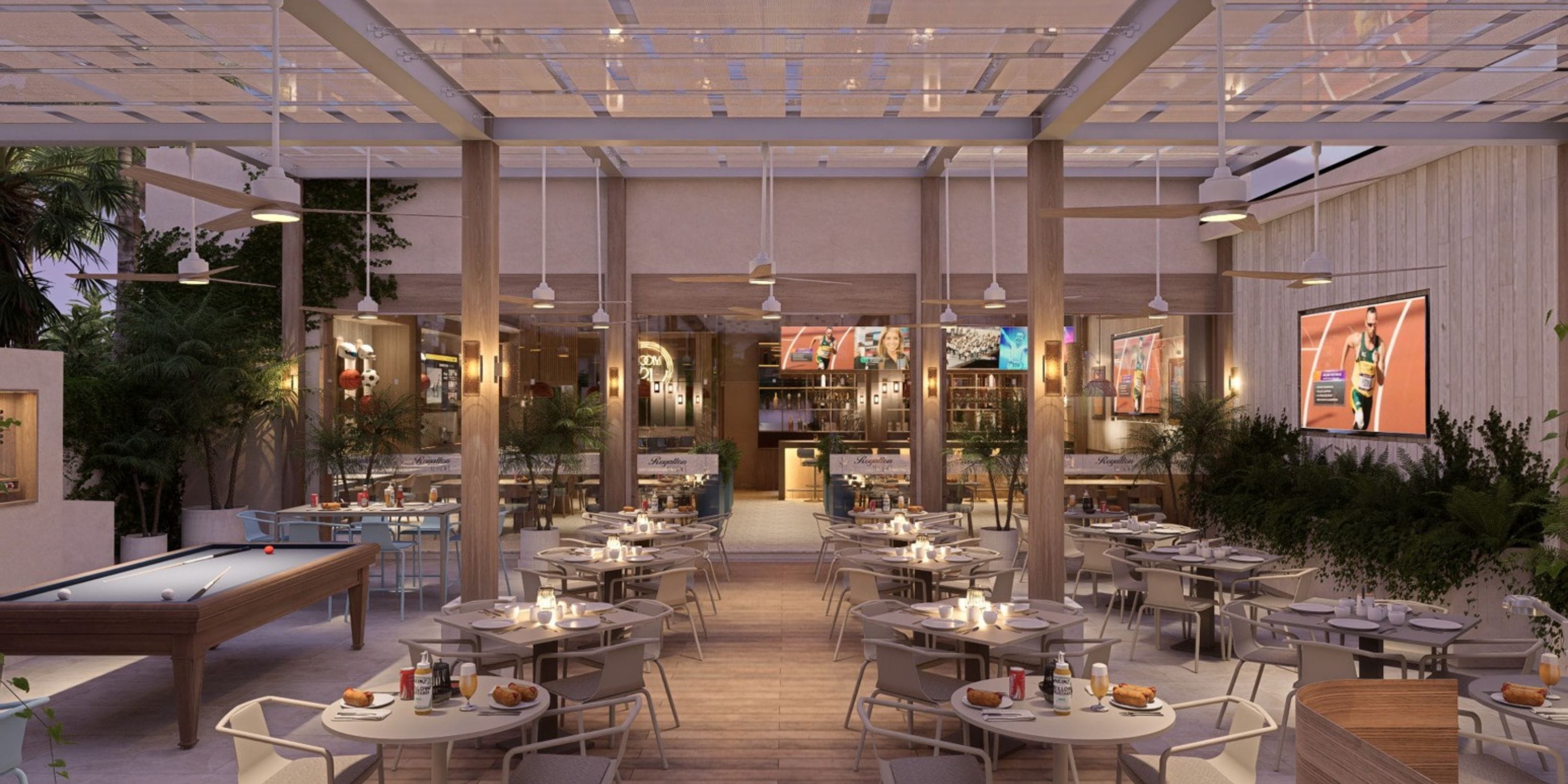 Chic outdoor restaurant at Royalton Riviera Cancun, perfect for weddings, with TVs and pool table.