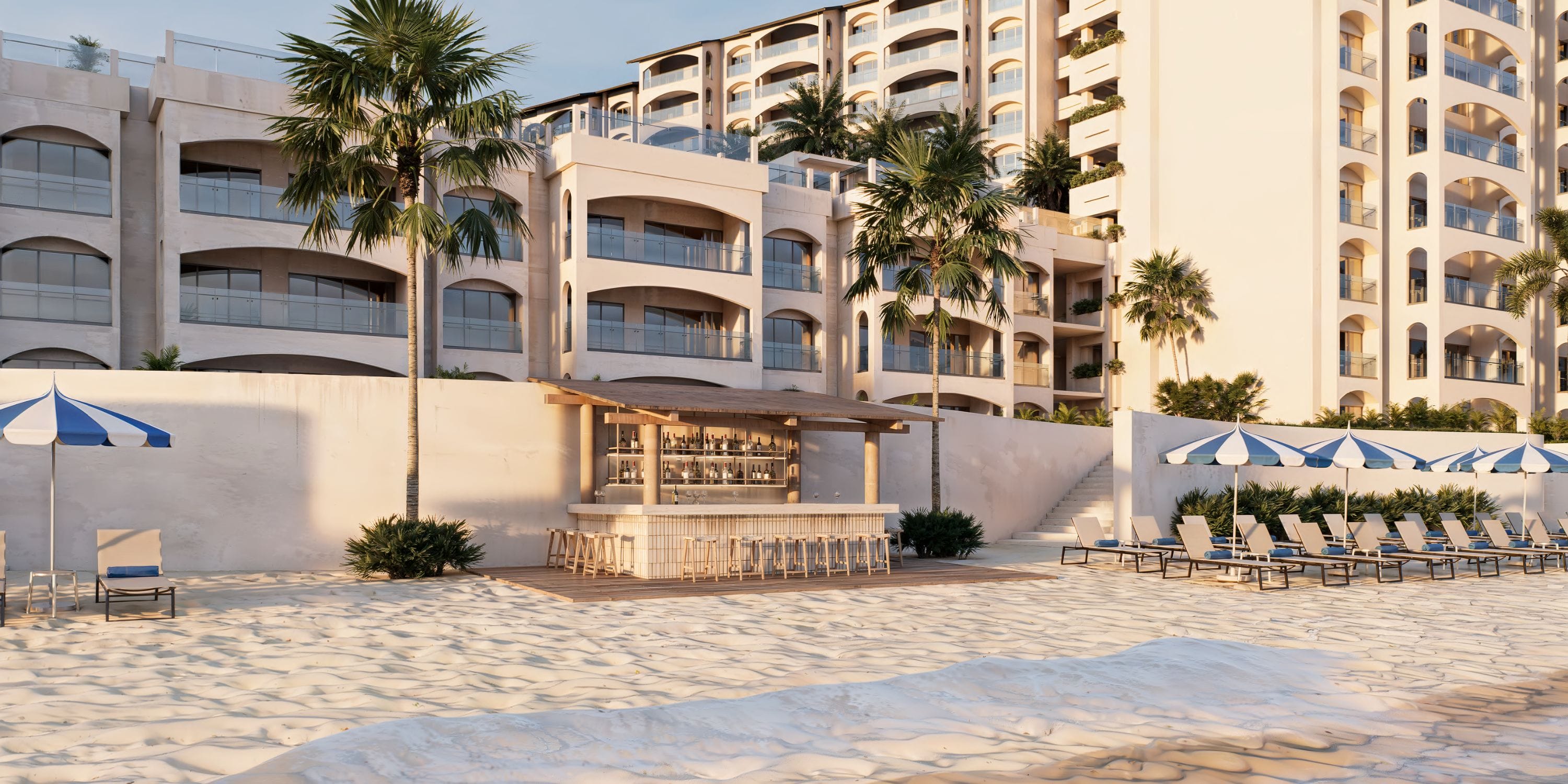 Royalton Riviera Cancun: Destination wedding hotel with pool bar and beachside lounge chairs.