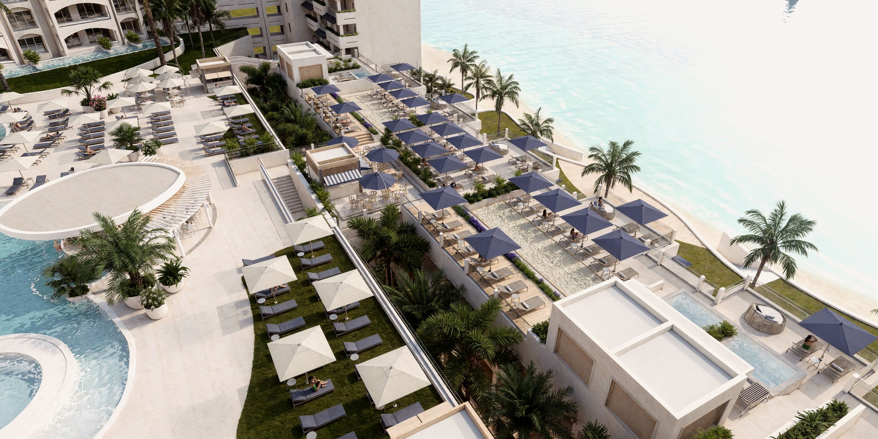 Aerial view of Royalton Riviera Cancun, a wedding venue with pools and palm trees.