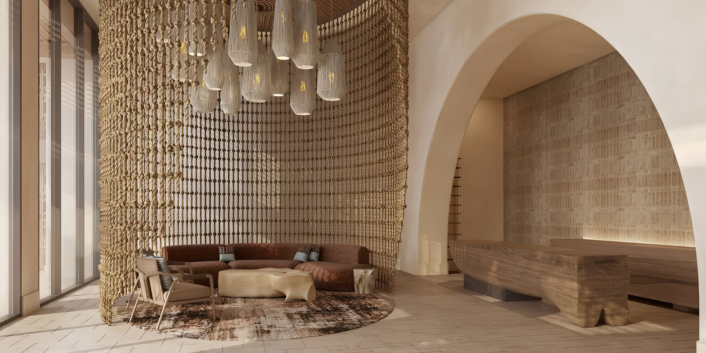 Grand Hyatt Los Cabos: stylish lobby with curved wood desk, ideal for destination wedding arrivals.