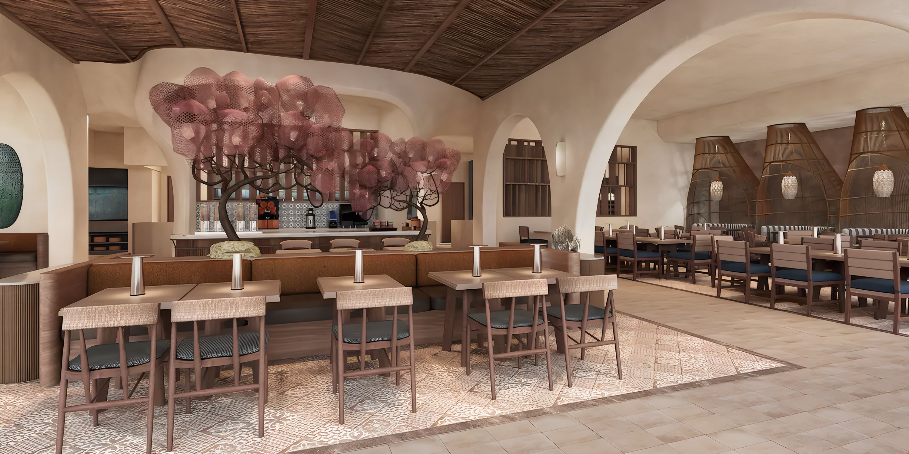 Grand Hyatt Los Cabos: Modern wedding venue with wood tables, plush chairs, and pink tree décor.