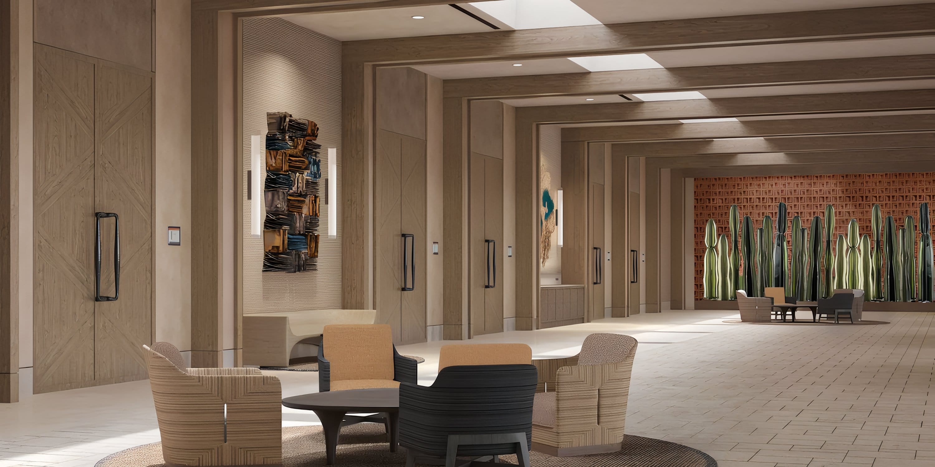 Modern hotel lounge ideal for destination weddings, with neutral chairs, wood accents, and wall art.