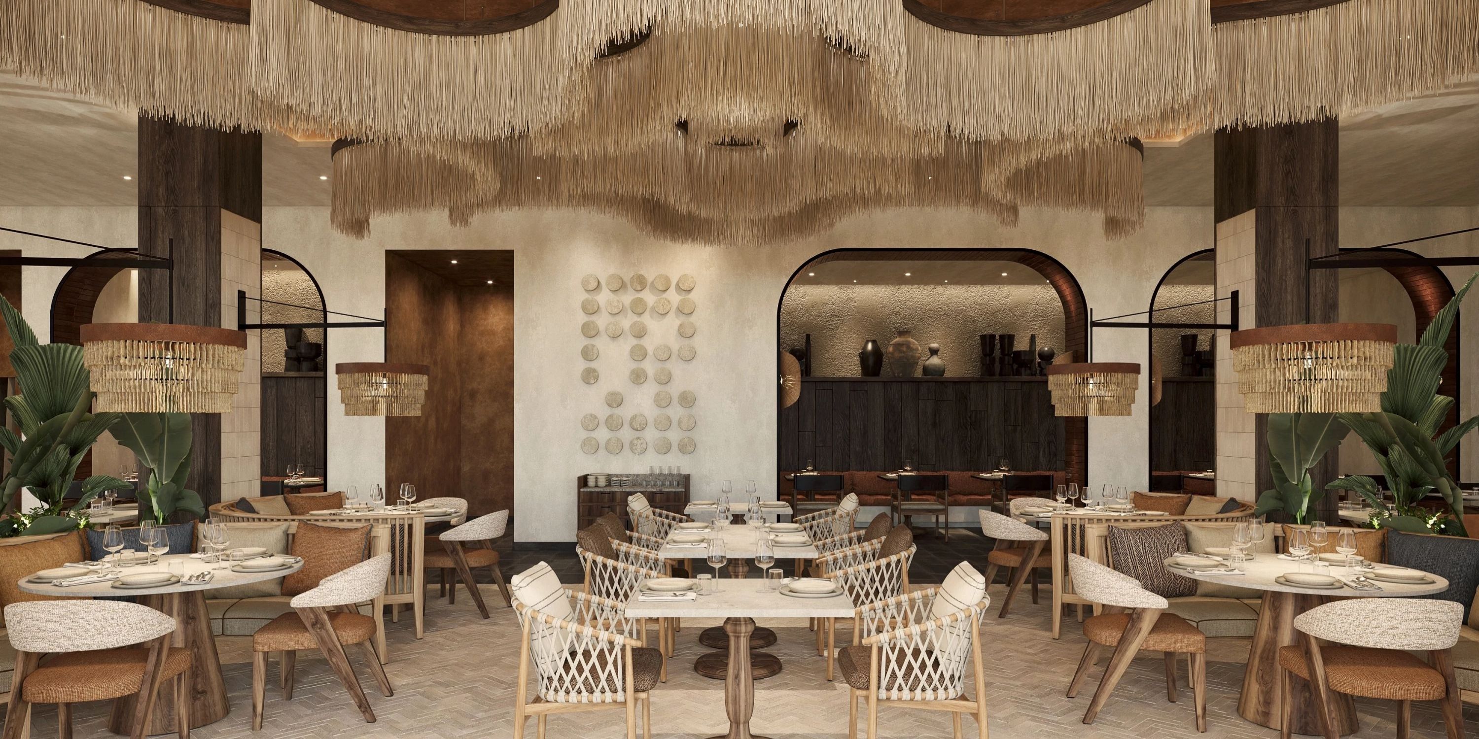 Dreams Macao Beach: chic wedding venue, woven chairs, round tables, fringe ceiling decor.