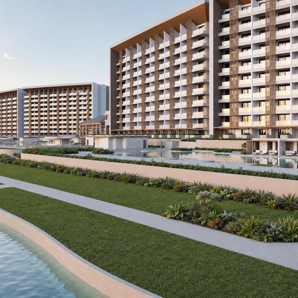 Large modern hotel complex with pools and gardens, perfect for a destination wedding.