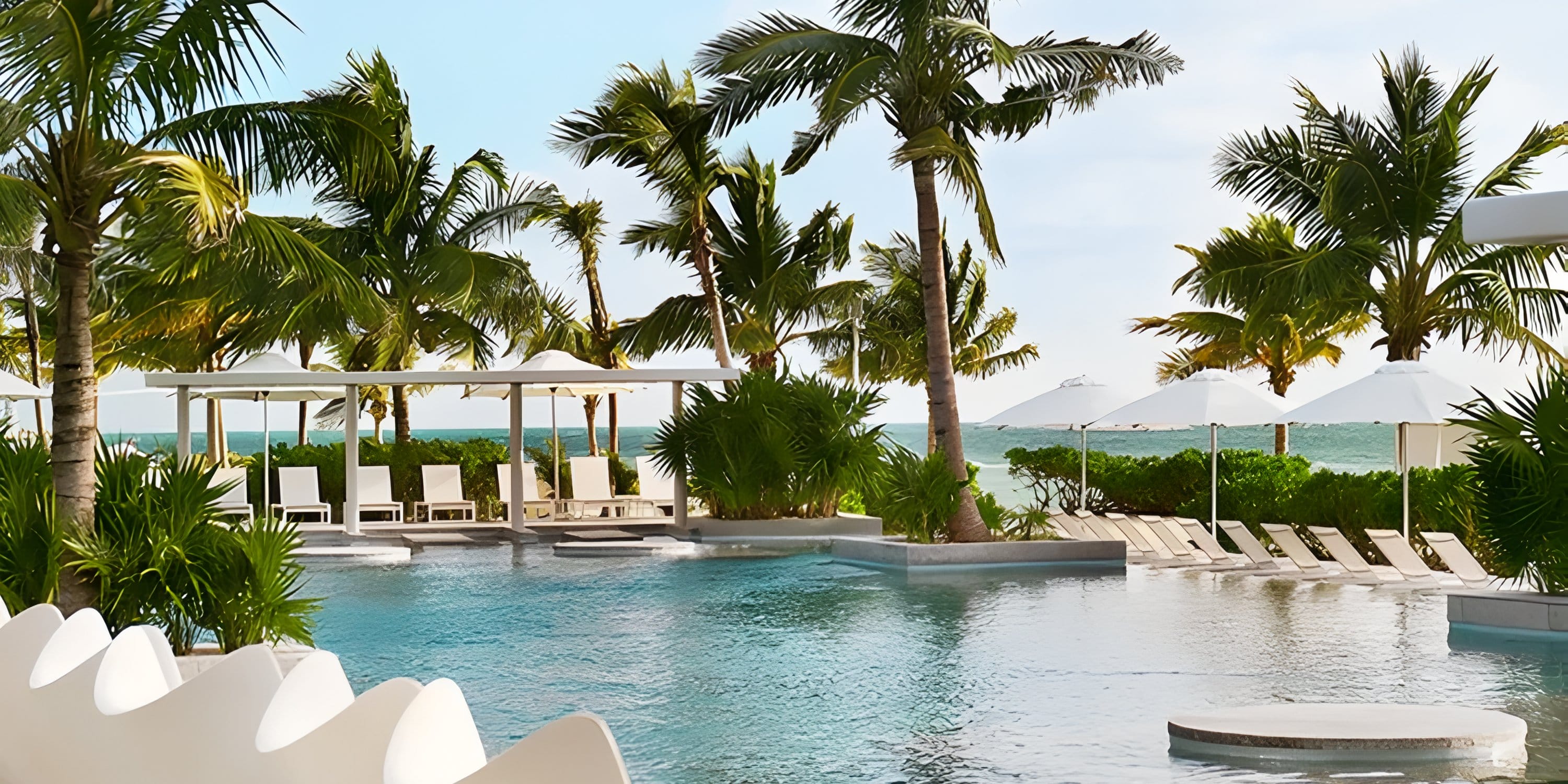 Swimming pool at Dreams Playa Mujeres beachfront resort, a perfect destination wedding spot.