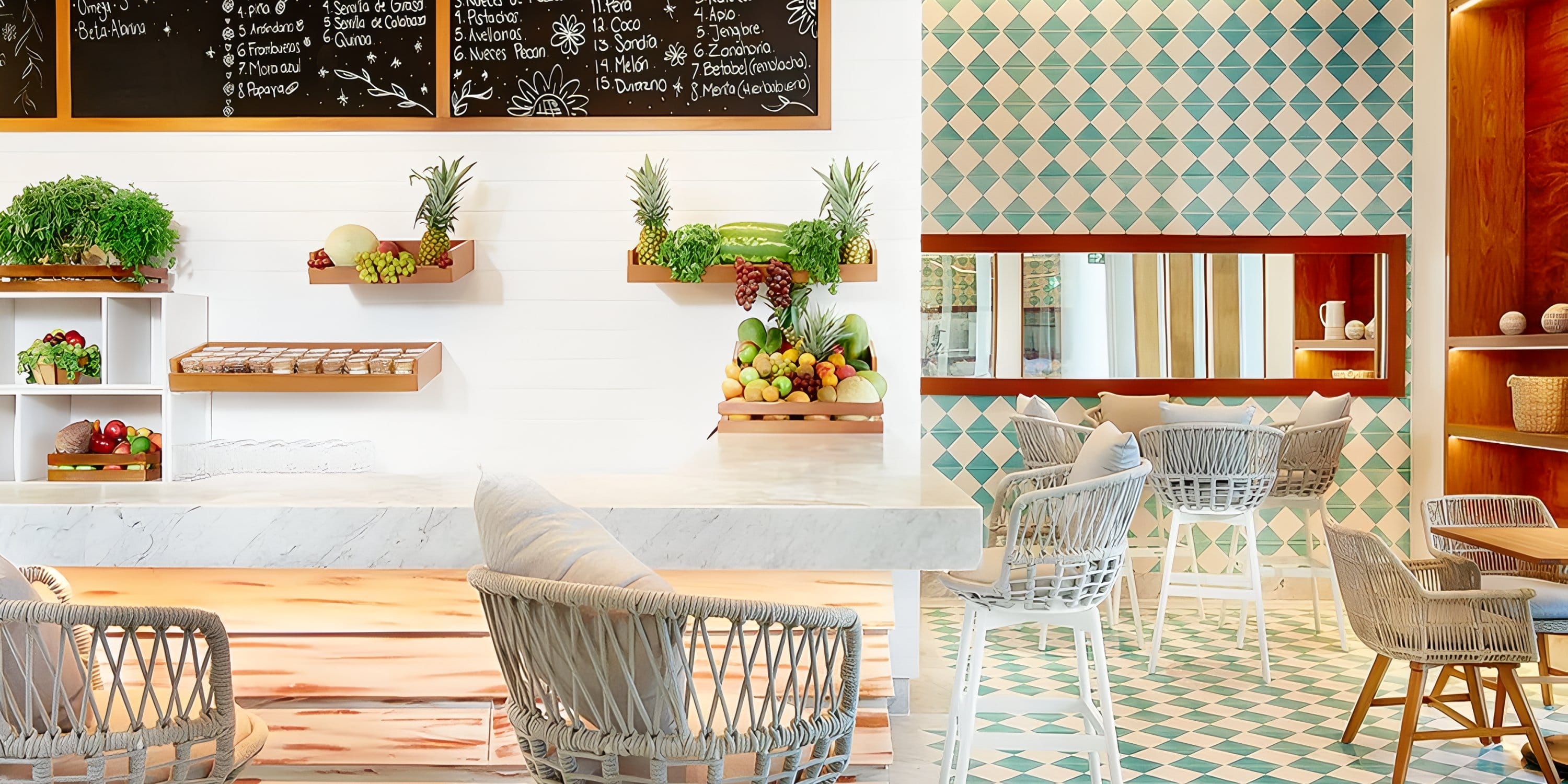 Fresh fruit counter and chalkboard menu at a Dreams Playa Mujeres destination wedding venue.
