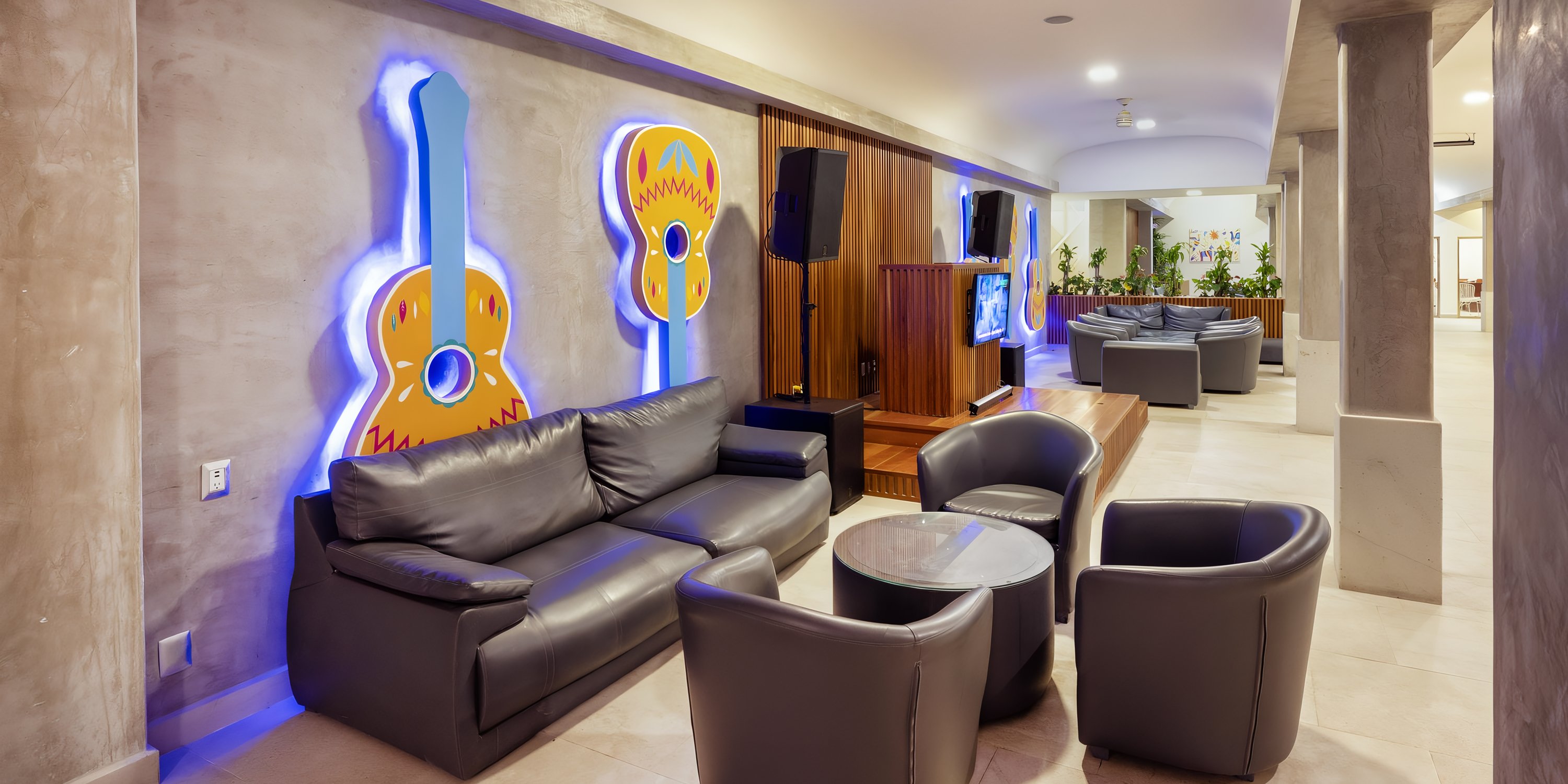 Dark leather lounge furniture at a Viva Maya destination wedding resort.