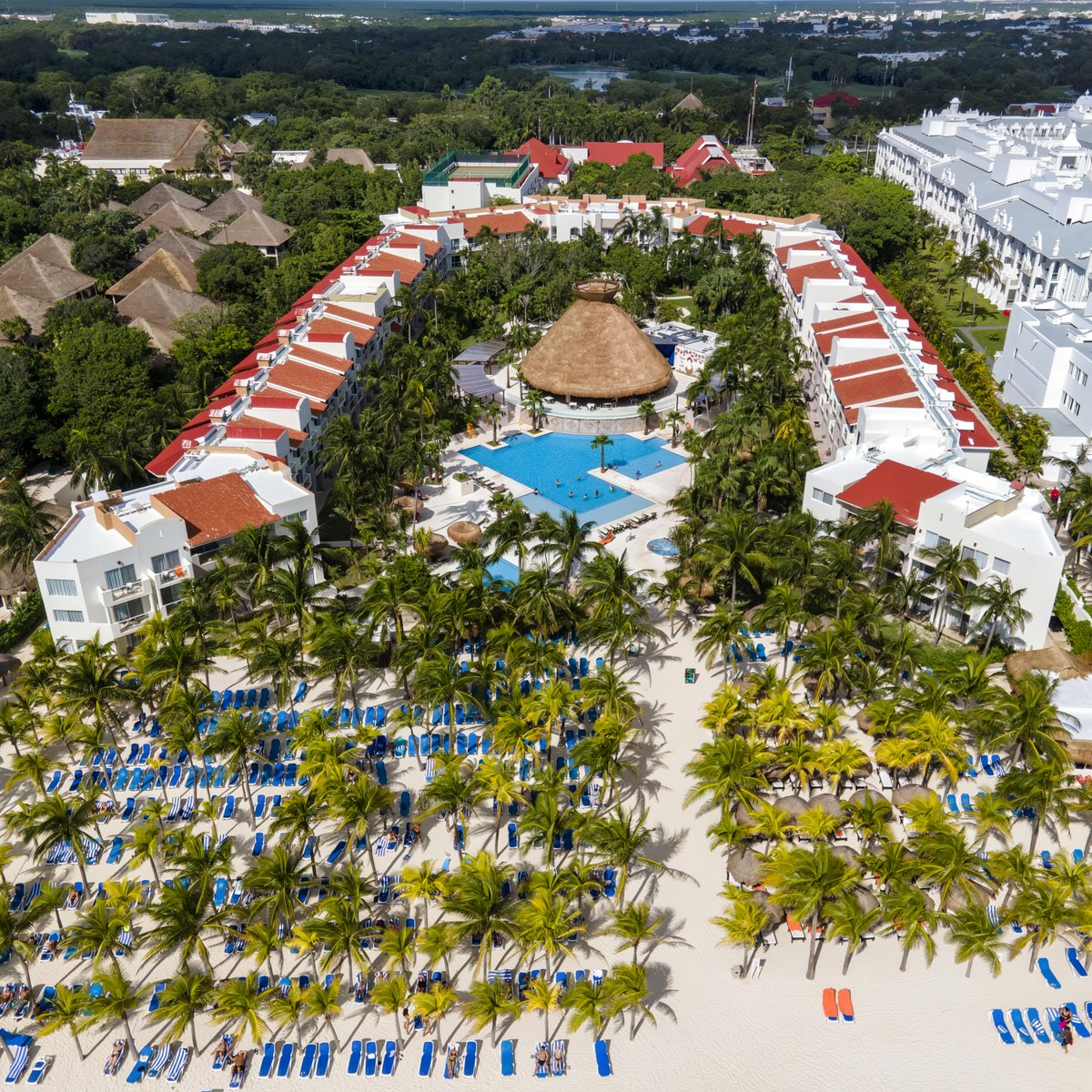Aerial view of Viva Maya by Wyndham, a destination wedding resort with a pool and sandy beach.