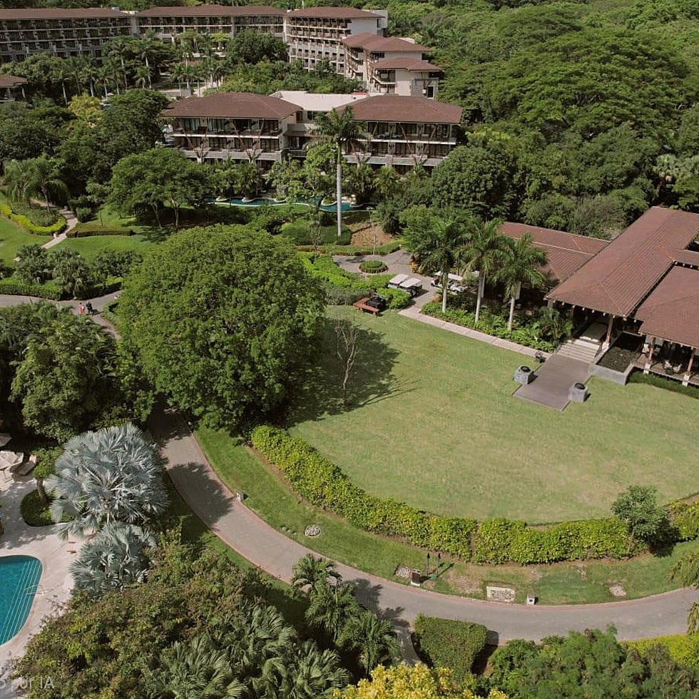 Aerial view of a tropical resort venue, a popular destination wedding spot.